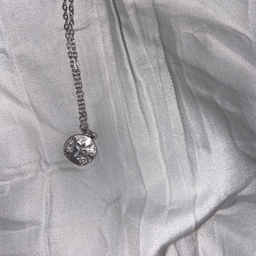 Silver sand dollar necklace